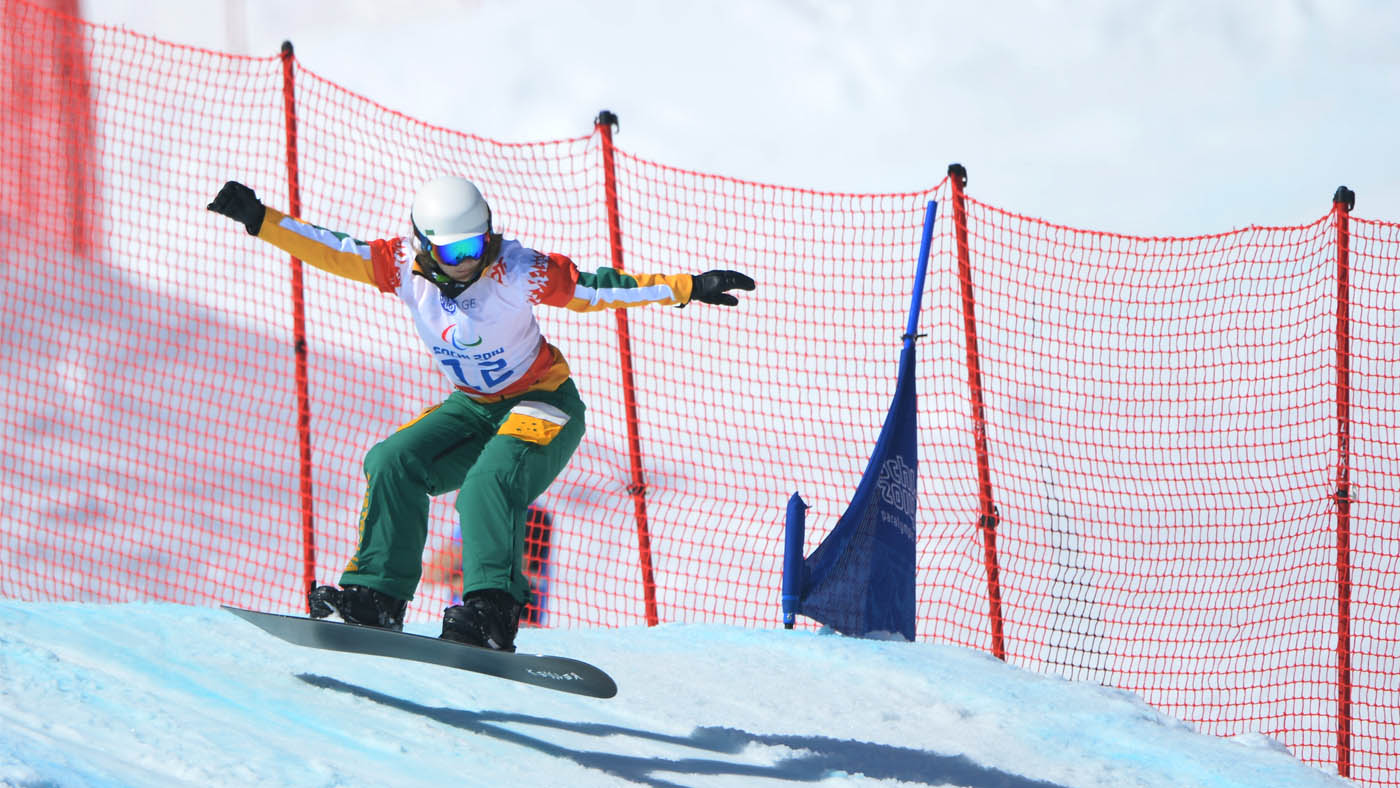 Joany Badenhorst goes over a jump on a snowboard at the Sochi 2014 Paralympic Games