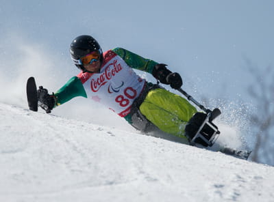 Sit-skier Sam Tait in action on the ski slopes