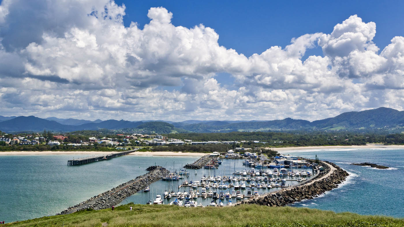 View of the breakwater with marina and Jetty Beach at Coffs Harbour