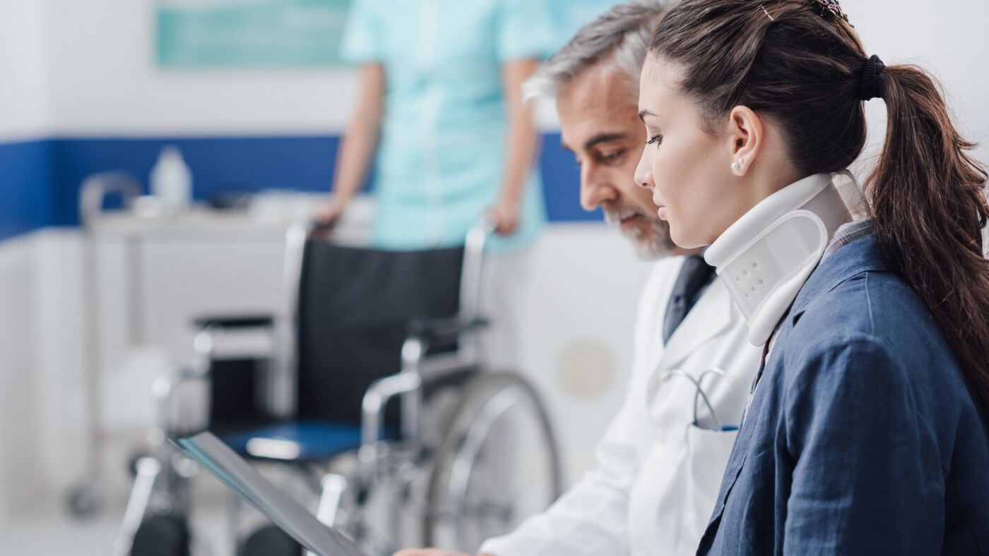 Spinal cord injury research - female patient and doctor