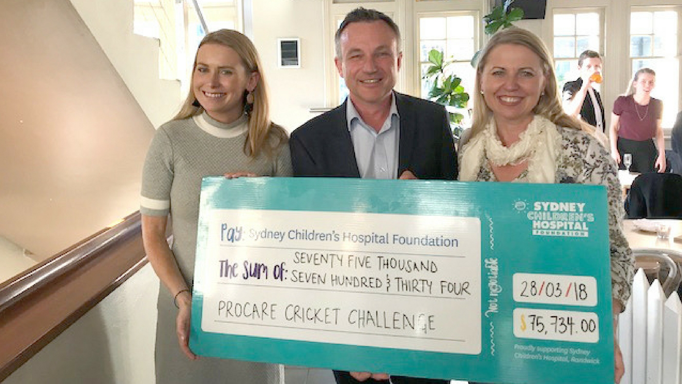 people holding cricket challenge cheque