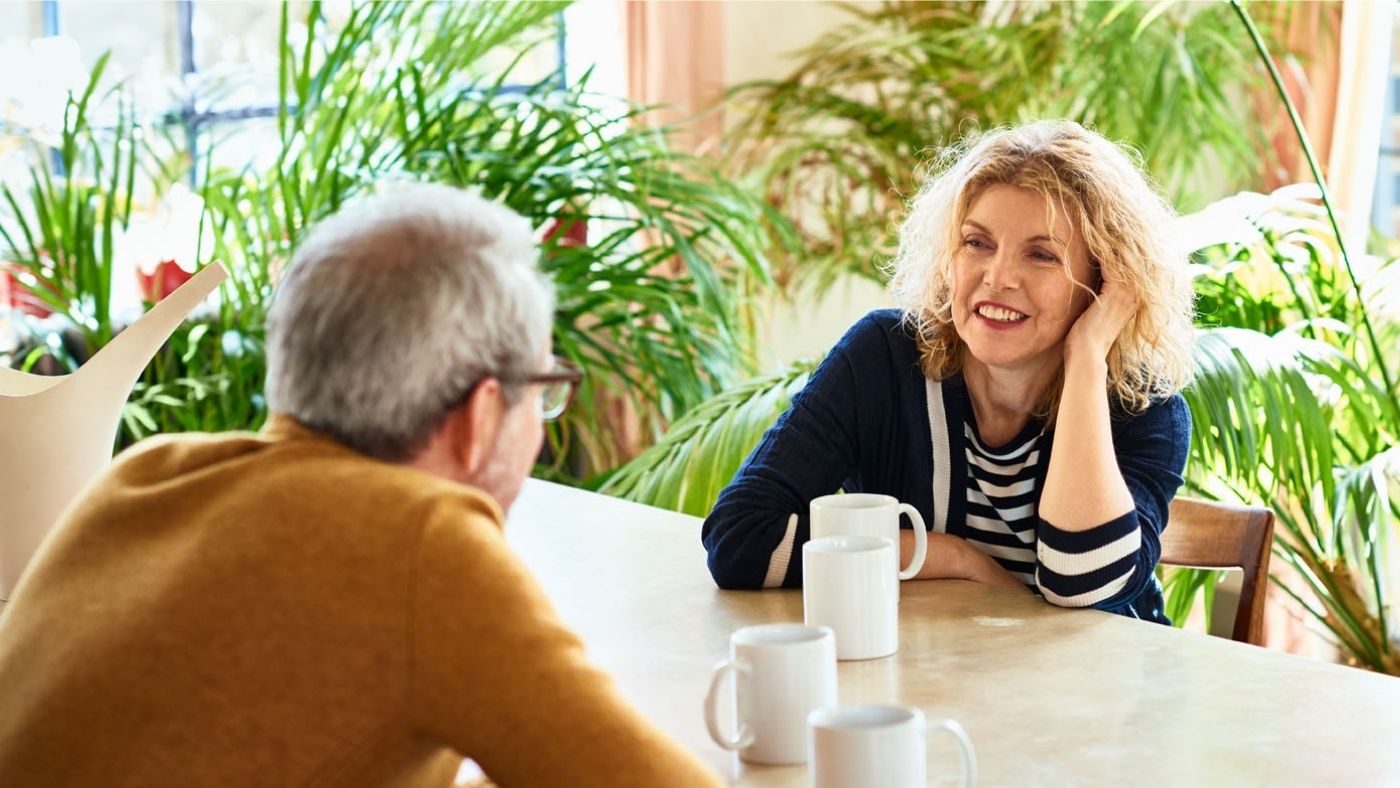 Two adults have a chat