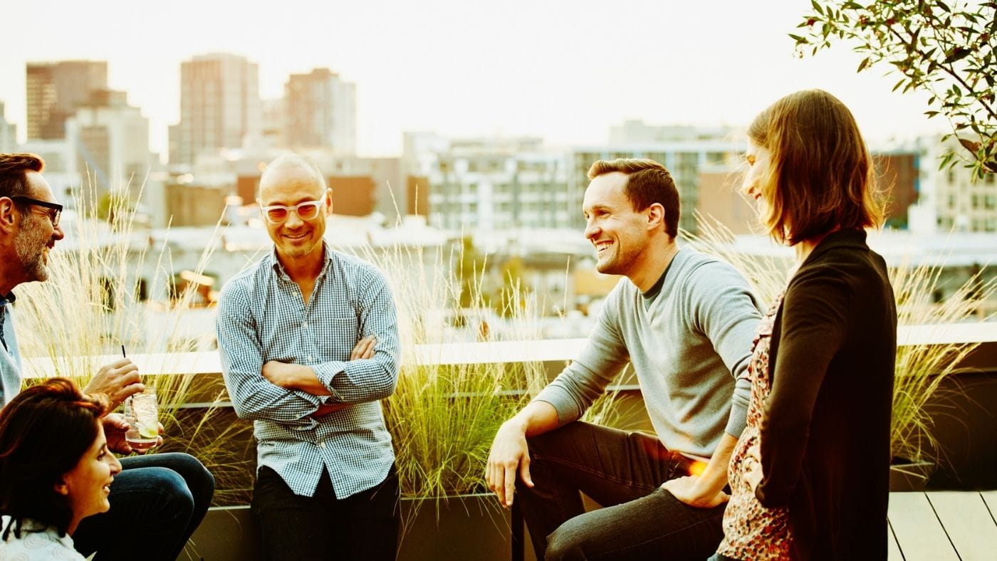 Colleagues socialising on a rooftop