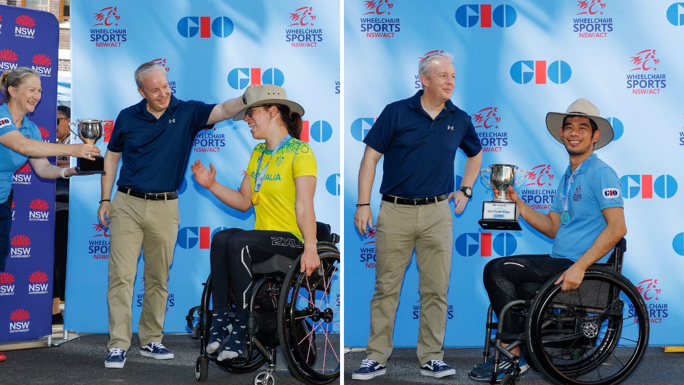 icare's Oz Day 10K Wheelchair winners being presented their trophies. On the left, female winner Sarah Clifton-Bligh and on the right, male winner, Jono Tang.