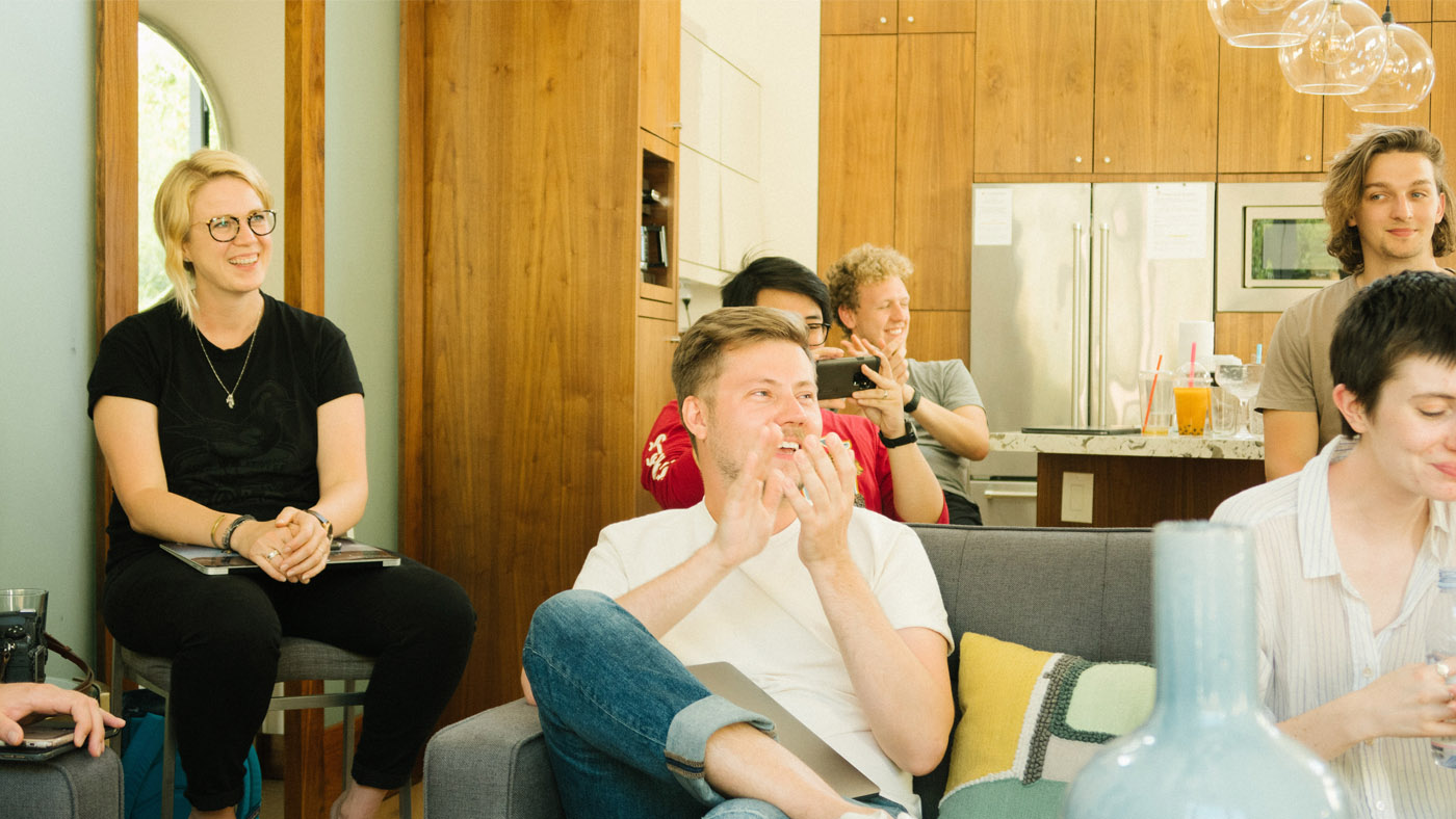 Colleagues smiling in a meeting