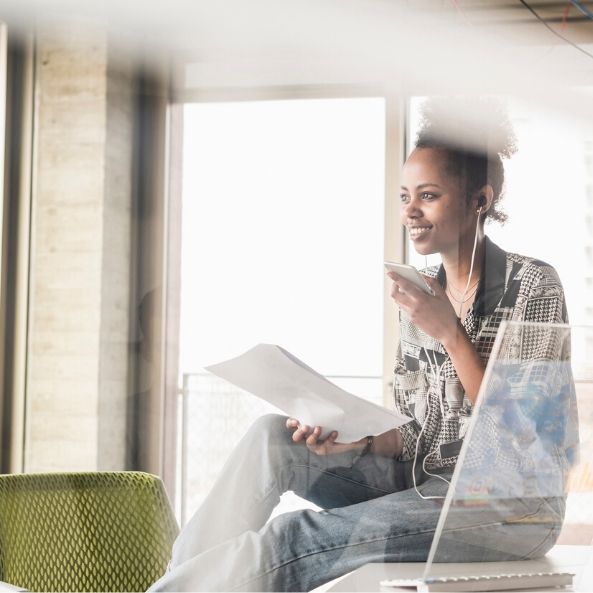 Young woman working in futuristic office 593x593 Young woman working in futuristic office