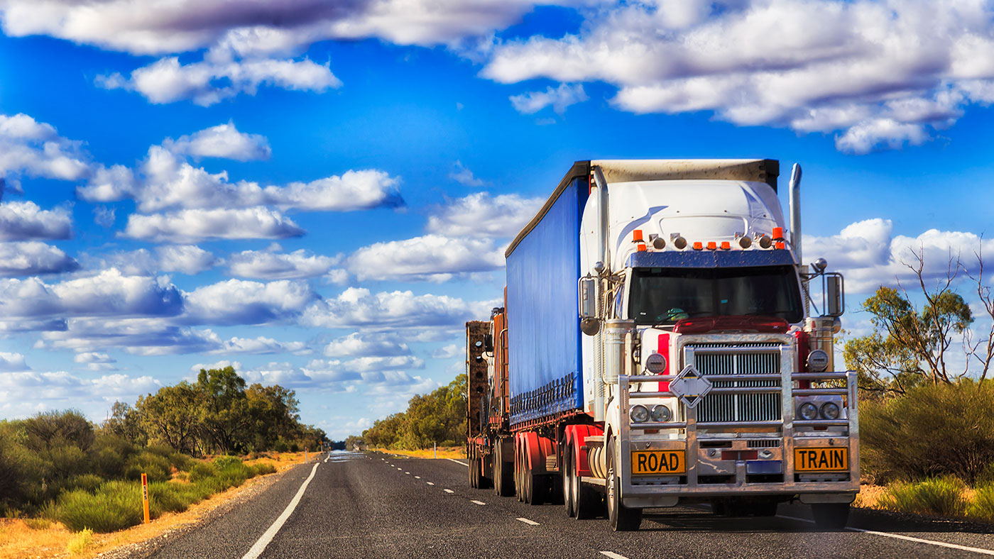 A truck driving on an open road.