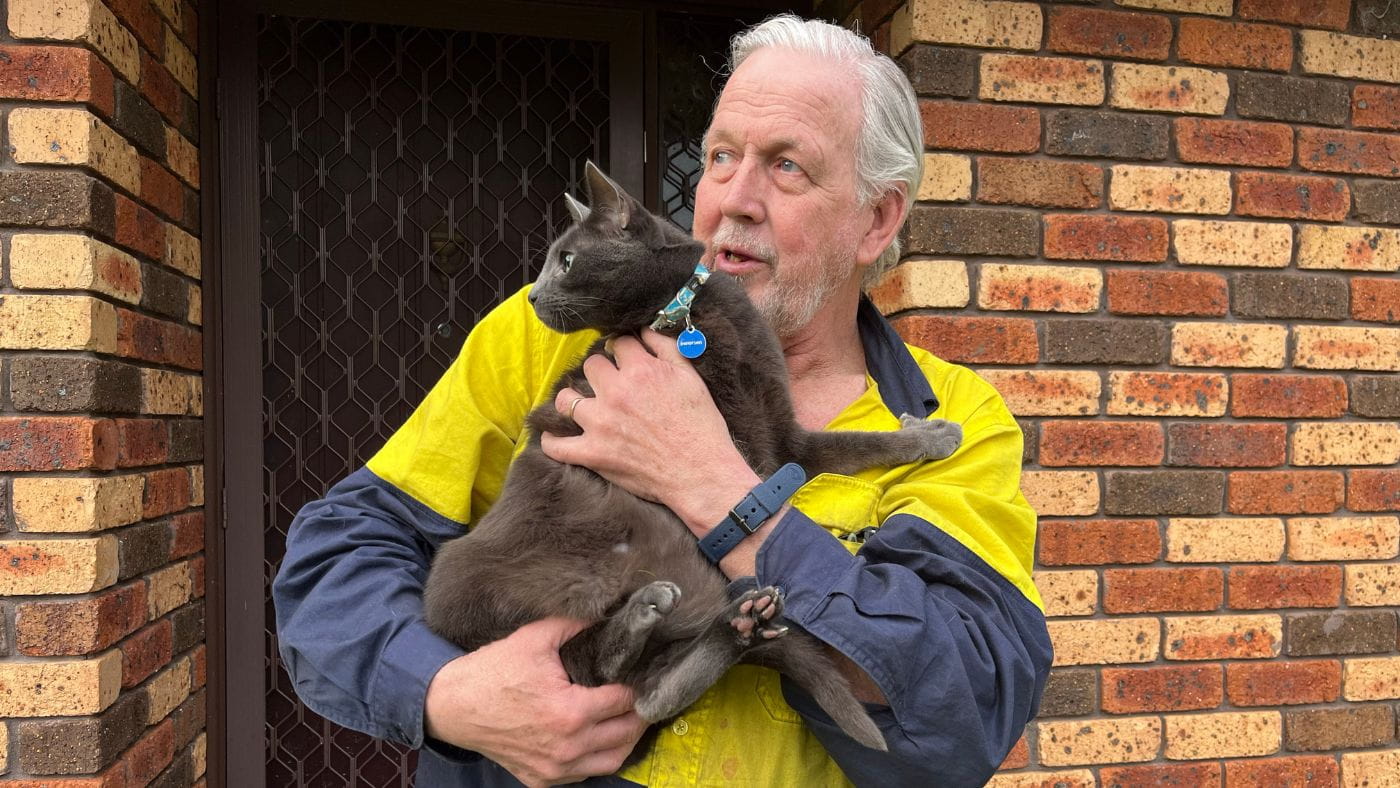 Steve Hills with his cat Buddy the Russian Blue