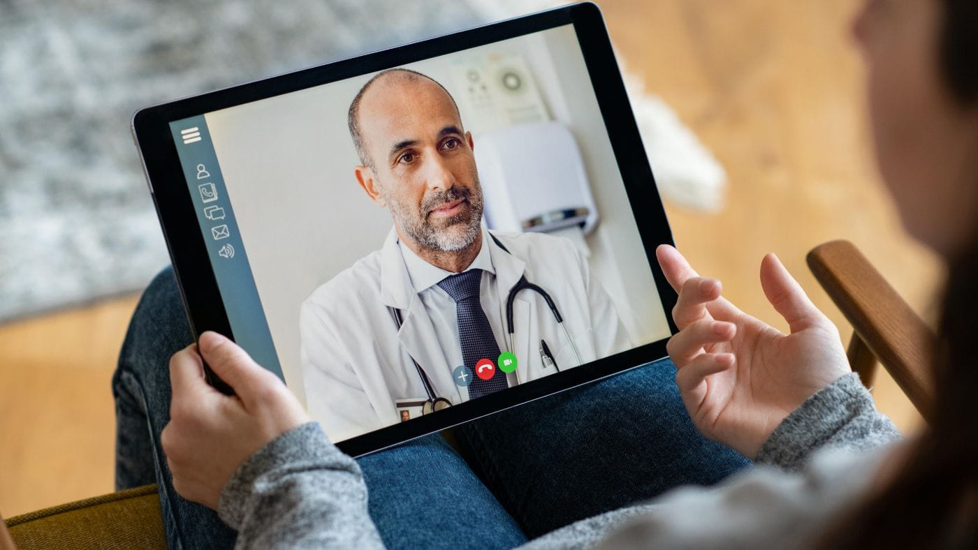 Female patient in telehealth consultation with doctor